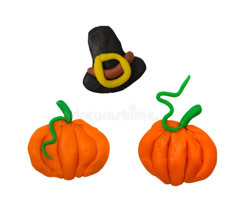 Pumpkins and thanksgiving hat isolated on white background. Plasticine kids holiday artwork. royalty free stock photos