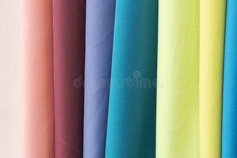 Samples of gabardine fabric. Samples of fabric - gabardine of different colors on the display case stock photos