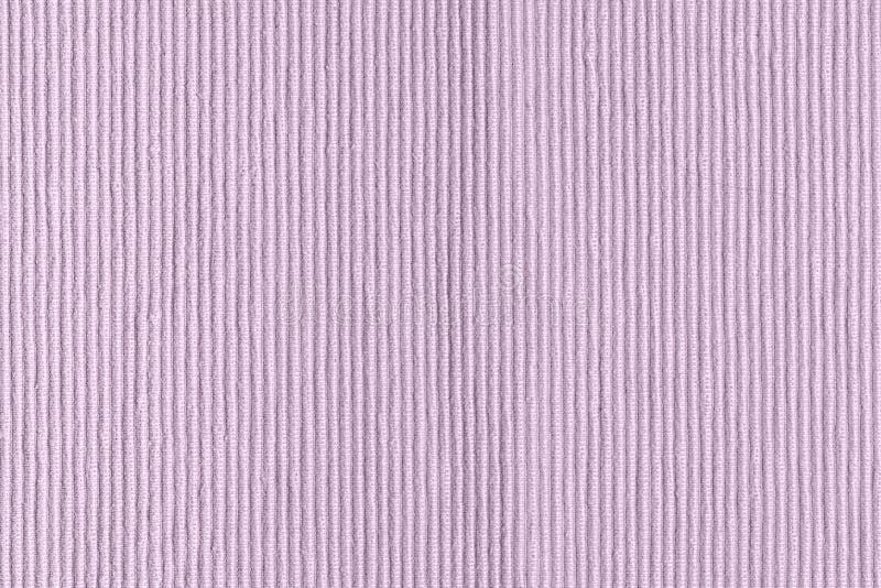 Sofa upholstery close-up. Texture of rough dense ribbed fabric. Lilac blank background. Sofa upholstery close-up. Texture of rough dense ribbed fabric. Lilac stock photography