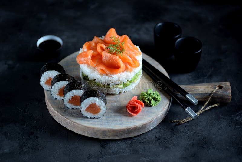 Sushi cake with lightly salted salmon, nori and avocado. Food stock image