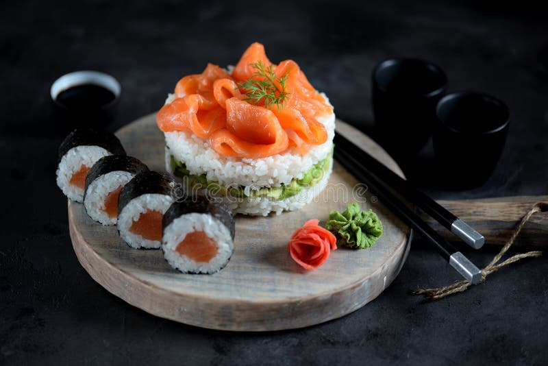 Sushi cake with lightly salted salmon, nori and avocado. Food royalty free stock photography