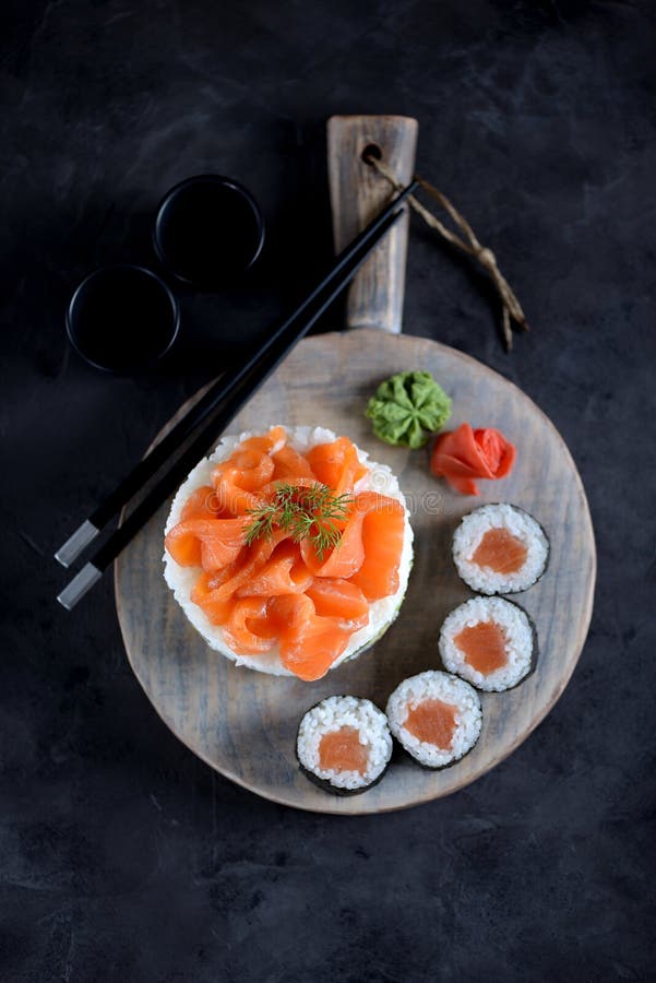 Sushi cake with lightly salted salmon, nori and avocado. Food royalty free stock photography