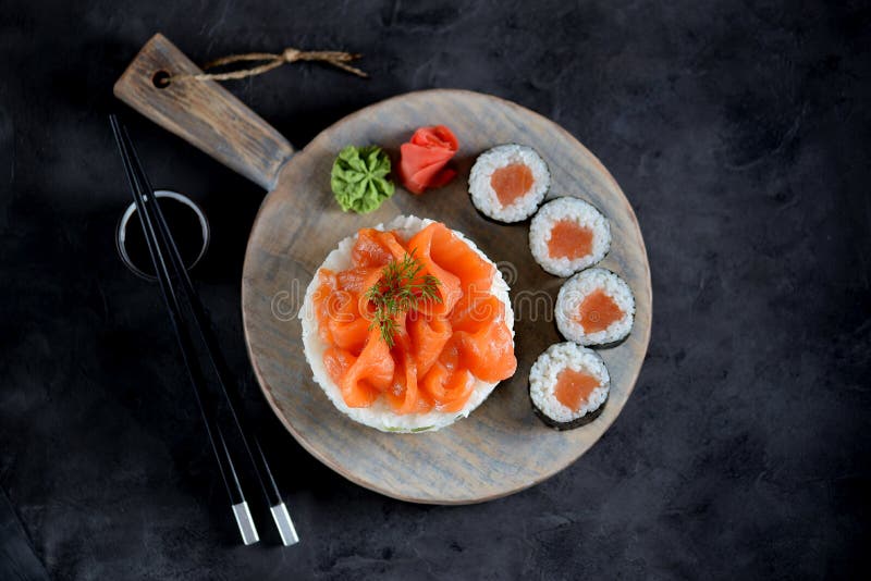 Sushi cake with lightly salted salmon, nori and avocado. Food stock photos