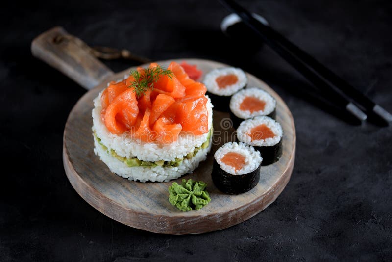 Sushi cake with lightly salted salmon, nori and avocado. Food stock images