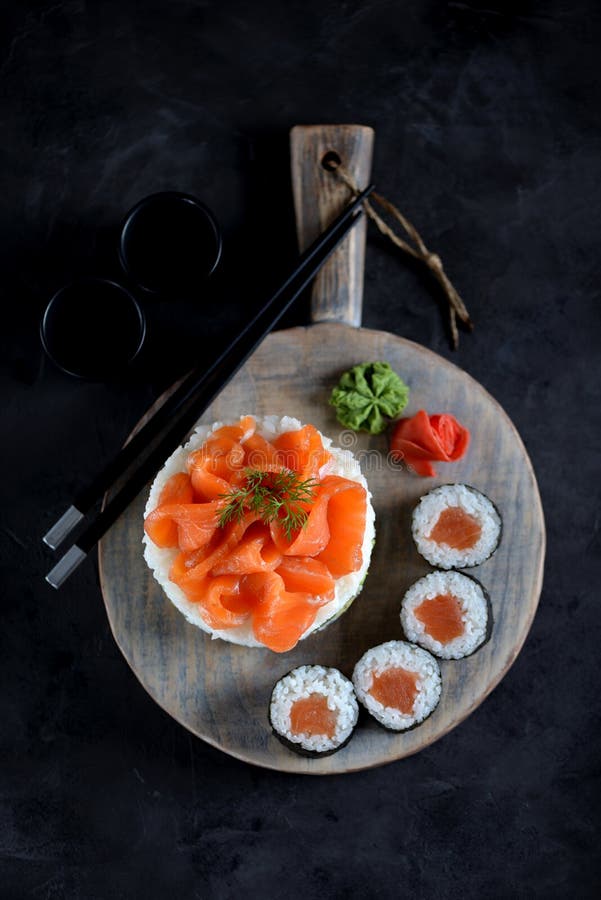 Sushi cake with lightly salted salmon, nori and avocado. Food stock photography