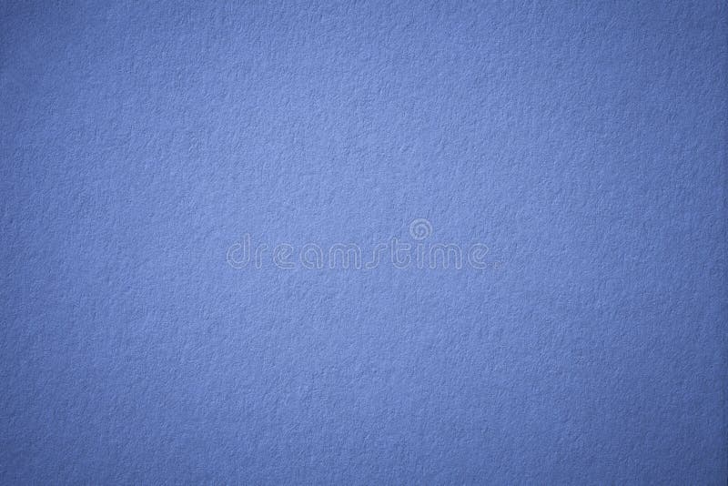 Texture of old navy blue paper background, closeup. Structure of dense dark denim cardboard. royalty free stock photos