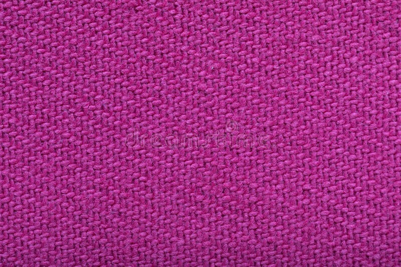 Twill weaving fabric, pink stitches as pattern, tissue structure closeup. Twill weaving fabric, pink stitches as a pattern, tissue structure closeup royalty free stock photography