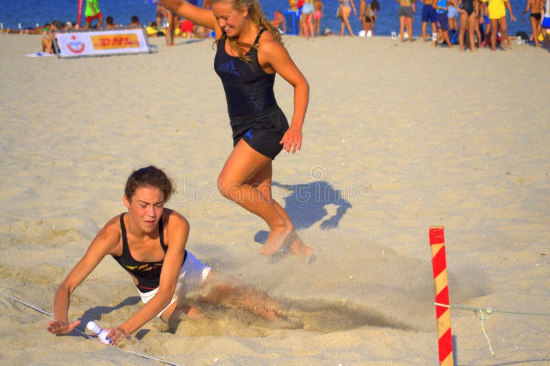 Two girls at beach race final. Two girls at the final effort of the final run of the 5th National tournament Young lifeguard on Varna beach,The winner one royalty free stock images