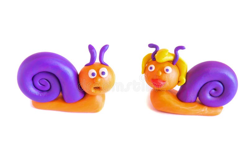 Two snails, clay modeling. royalty free stock image