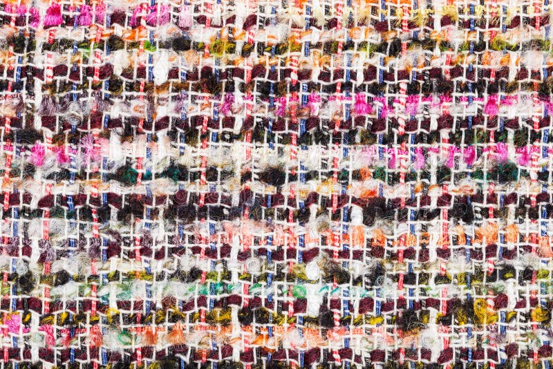Varicoloured woven yarns of boucle fabric close up. Textile background - varicoloured woven yarns of boucle fabric close up royalty free stock photos