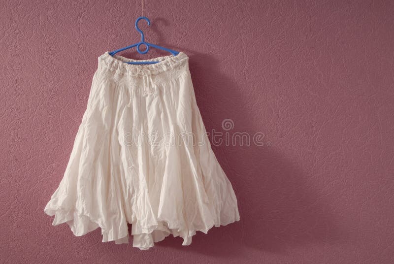 White cotton flared skirt. A white cotton flared skirt stock photo