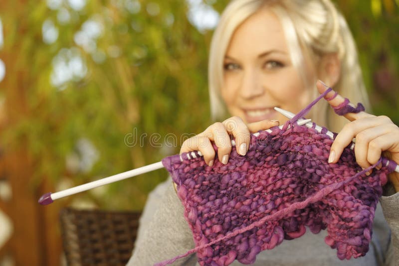 Woman knitting outdoor royalty free stock photography