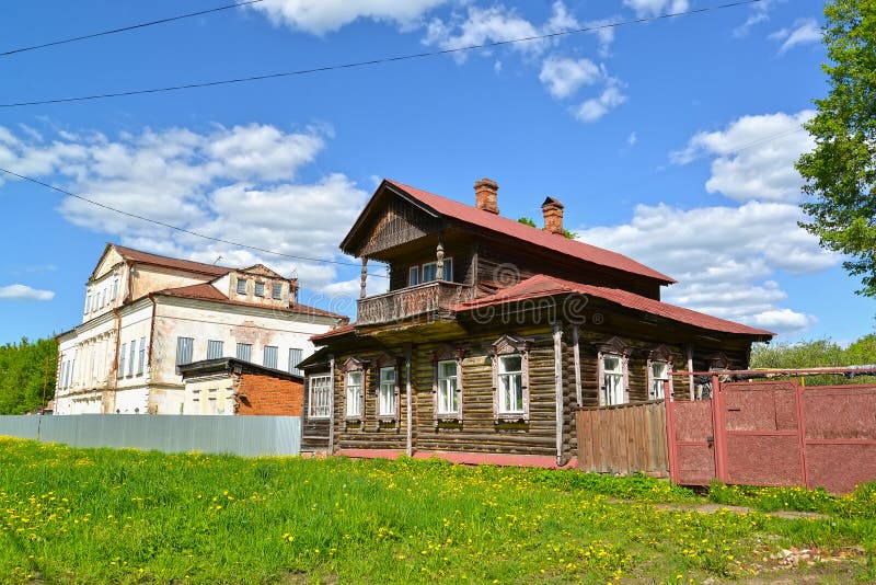 Wooden house with the mezzanine and the stone mansion of the 19th century. Uglich, Yaroslavl region.  stock image