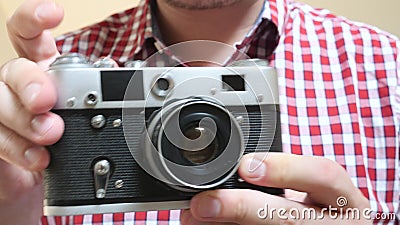 Photographer holds in hands old photo camera stock footage