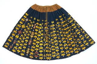 Skirt, indigo dyed cotton embroidered with yellow floss silk (phulkari), makers unknown, about 1867, Bannu, Pakistan. Museum no. 05668(IS). © Victoria and Albert Museum, London 