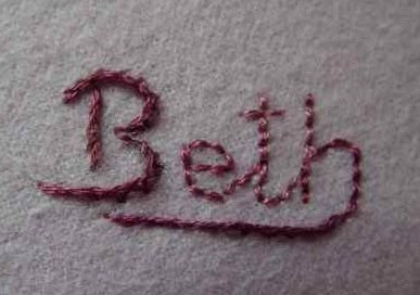 A name embroidered on a blanket