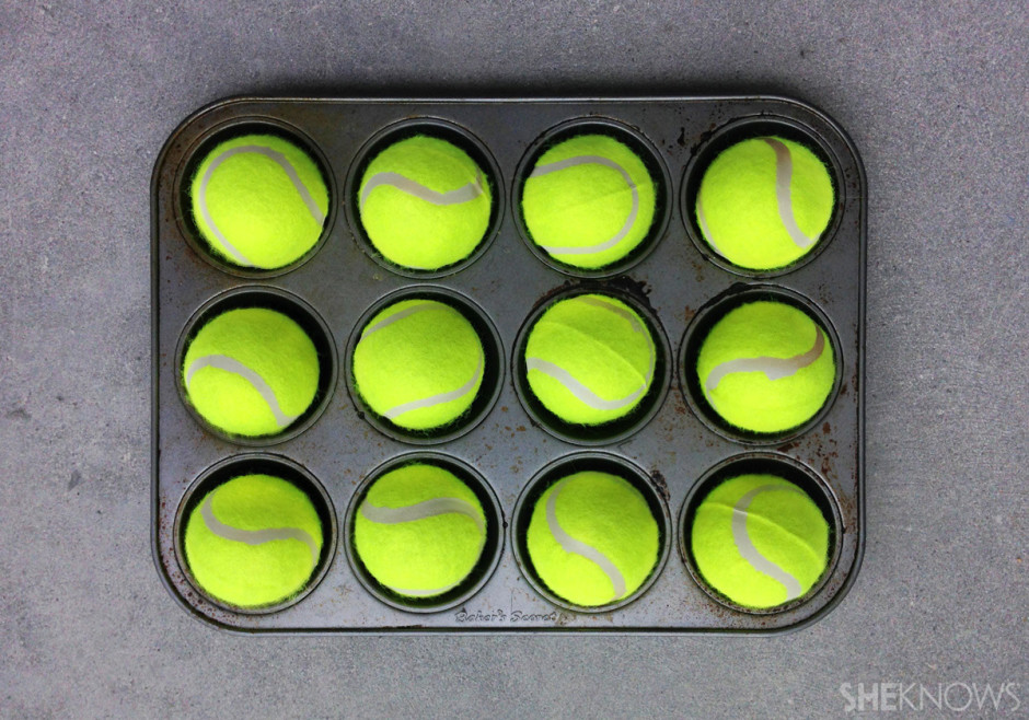 You can make your own doggie puzzle with a muffin tin & tennis balls via sheknows