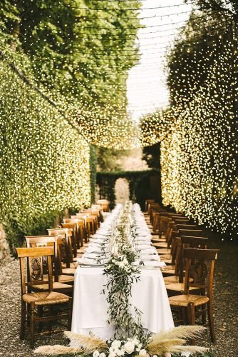 wedding table decorations outdoor long table decorated with greenery tablerunner gabrielefaniphotographer
